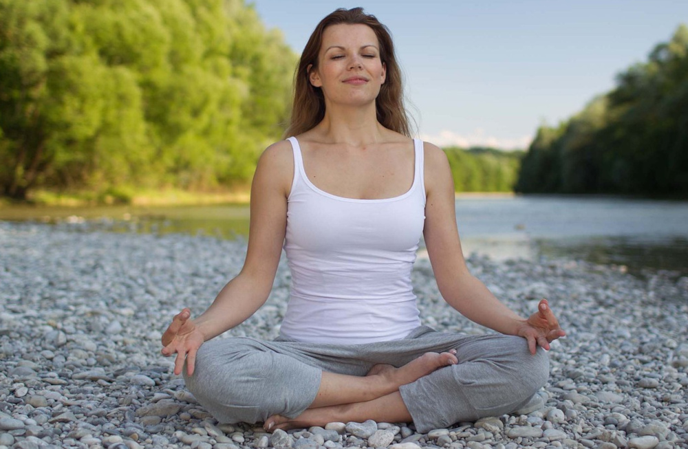 woman meditating in nature